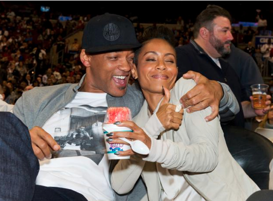 Will Smith and Jada Pinkett Smith enjoying themselves at a 76ers game.